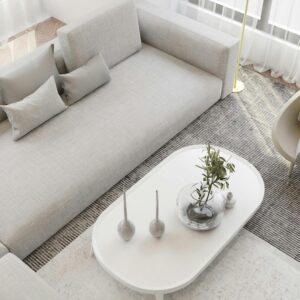 Bright and cozy minimalist living room with beige sofa and modern decor.
