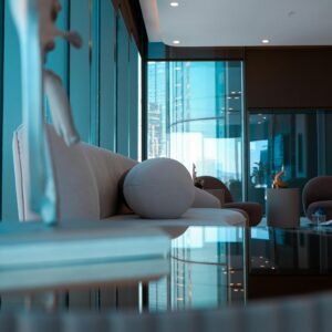A modern lounge with sleek furniture and ambient lighting, reflecting a stylish interior design.